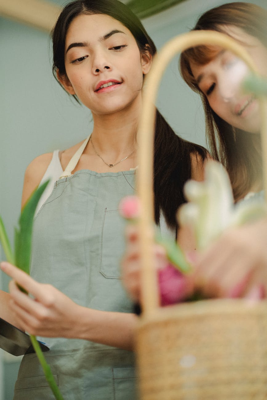 Flora Flicks florist crafting a beautiful arrangement